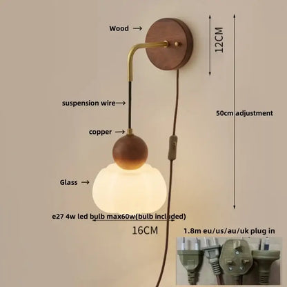 Modern brass and wood wall light with a round wooden base brass accents and ribbed glass globe shade for bedroom decorbites copper adjustable led