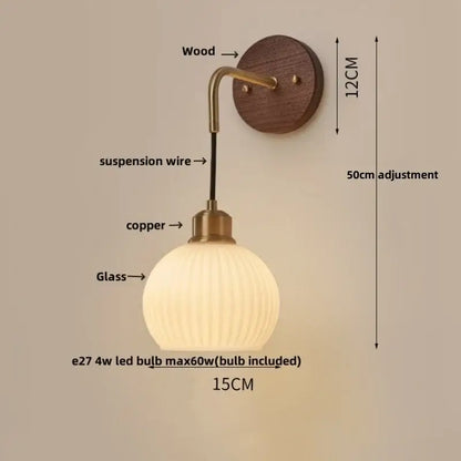 Modern brass and wood ribbed glass wall light with warm-toned globe on a copper adjustable arm for bedroom decorbites copper adjustable led