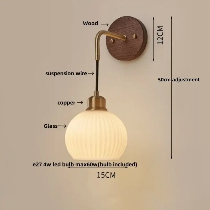 Modern brass and wood ribbed glass wall light with warm-toned globe on a copper adjustable arm for bedroom decorbites copper adjustable led