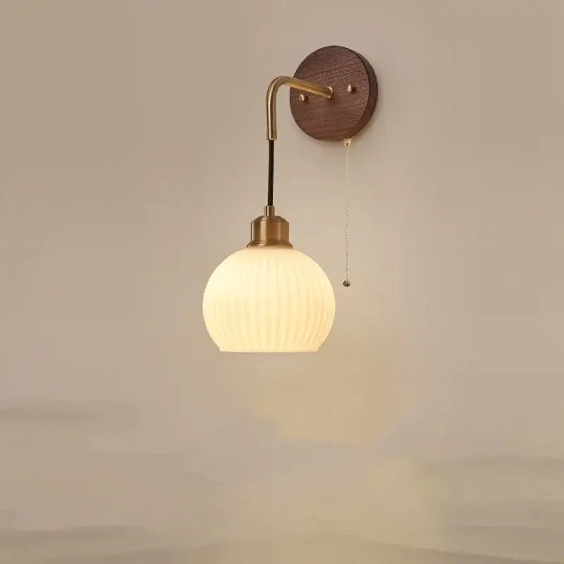 A warm-toned ribbed glass wall light with brass arm and wooden backplate for modern bedroom decorbites copper adjustable use