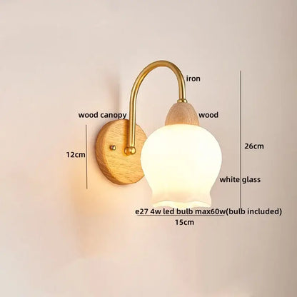 A warm-toned modern brass and wood tulip led wall lamp with a soft white glass shade for living room decorbites led wall Lamps