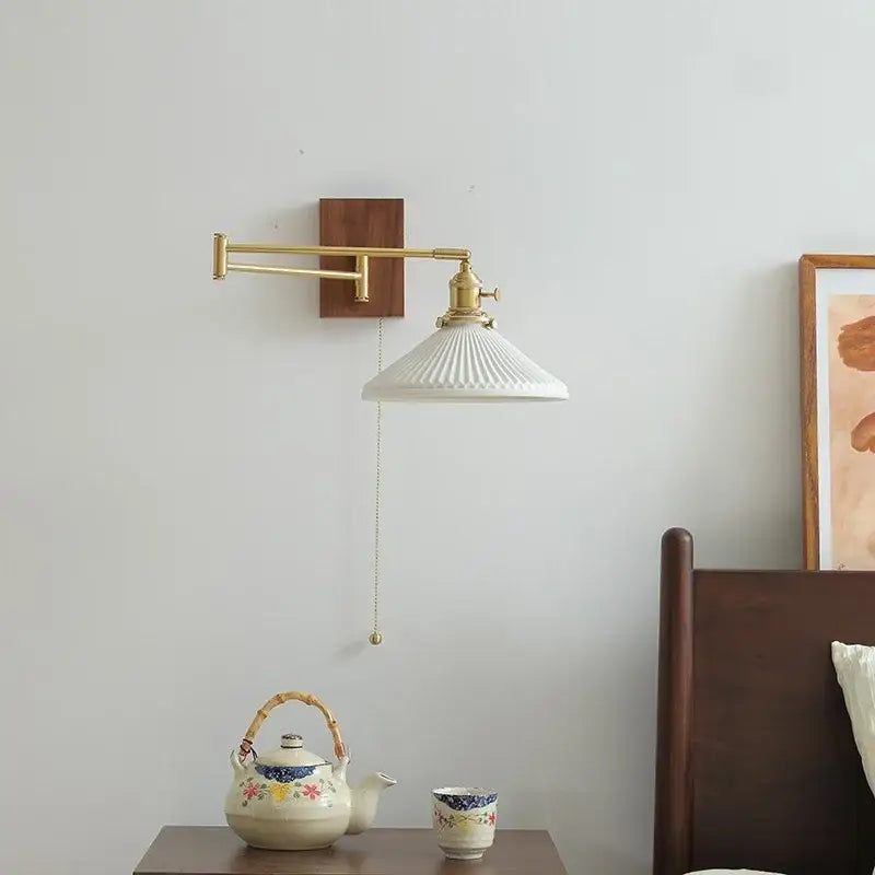 Modern brass and wood wall light with white ceramic copper fluted shade and brass arm mounted on wooden plate for bedroom decorbites ceramic copper led use