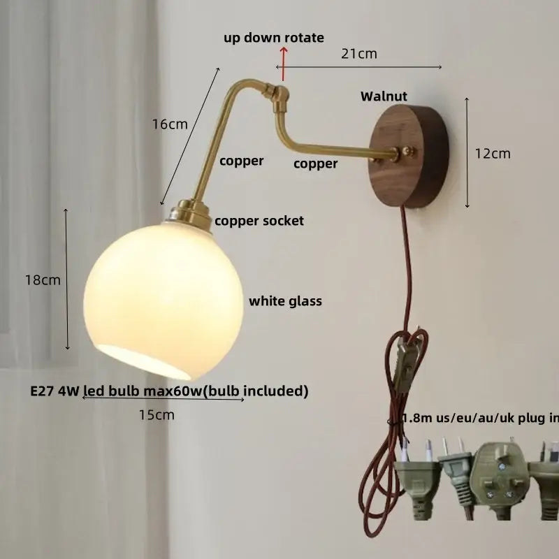 Modern brass and wood wall sconce with amber led, brass-finished copper globe, and walnut wood backplate by decorbites copper glass
