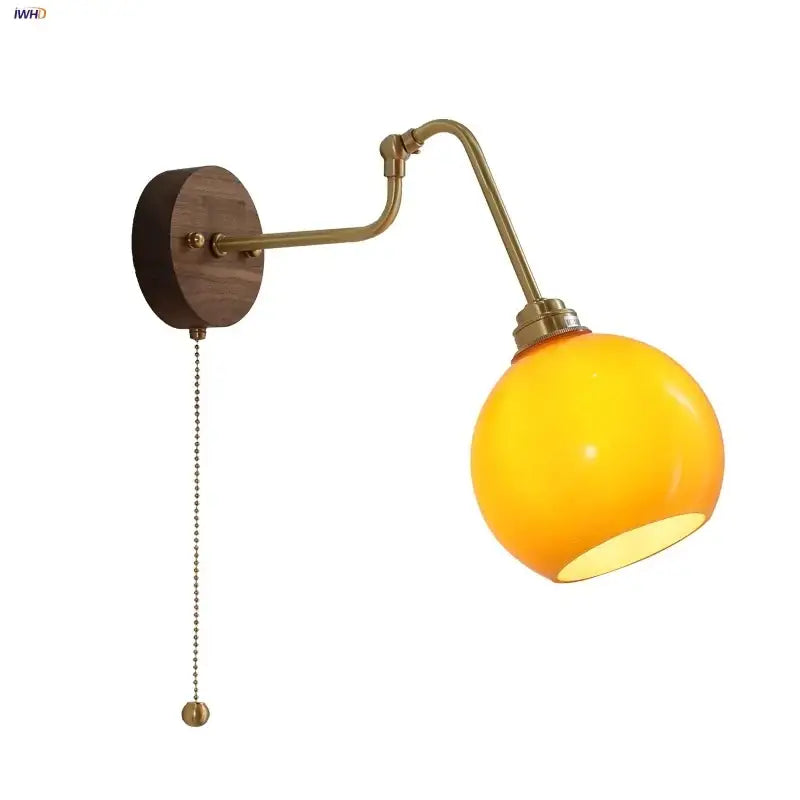 Modern brass and wood wall sconce with amber led warm yellow glass globe and wooden backplate decorbites copper glass decor