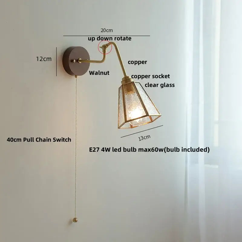 Modern brass and wood wall sconce with copper glass and amber led featuring a vintage-style etched clear glass shade