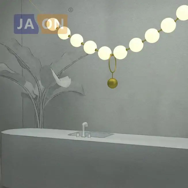 Modern brass artistic necklace chandelier pendant light with gold-toned spheres and glowing orb bulbs for living room decorbites brass artistic