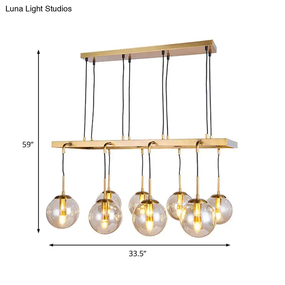 DecorBites™ brass ball island pendant light with seven clear glass shade globes in modern 220v-240v and 110v-120v design