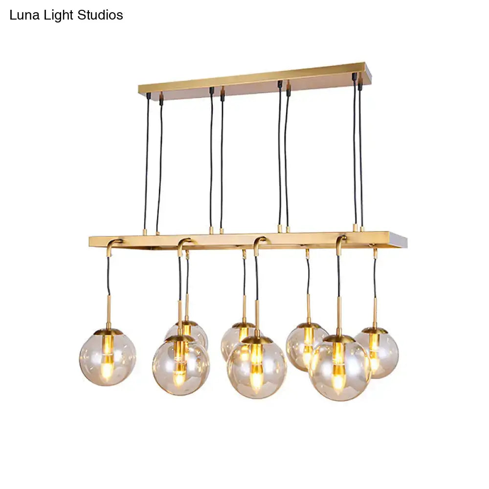 Modern brass rectangular chandelier with six clear glass shade globes suspended by black cords compatible with led incandescent fluorescent 220v-240v 110v-120v