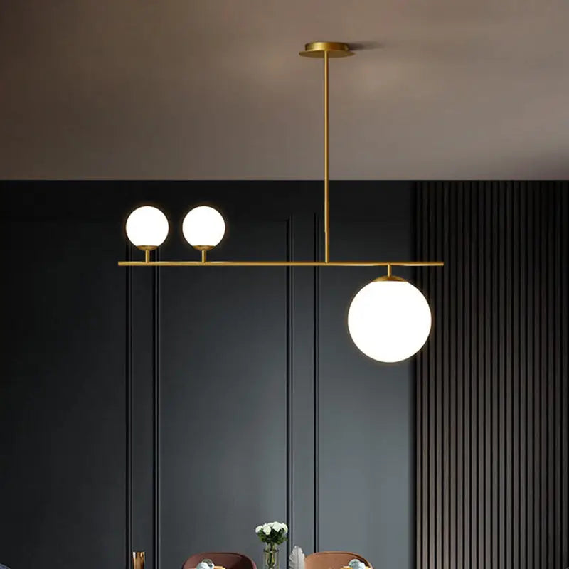 Modern gold-toned brass ball pendant light with three opal glass bulbs for dining room 110v-120v 220v-240v use