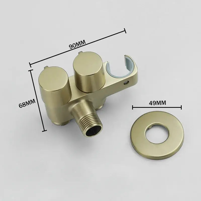 Modern brass bidet faucet set with gold-colored brass dual handles and built-in showerhead bracket for bathroom use