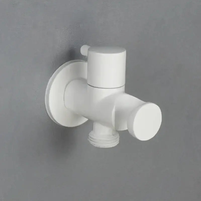 Modern brass bidet spray kit featuring a white plastic wall-mounted faucet with cylindrical handle and threaded spout
