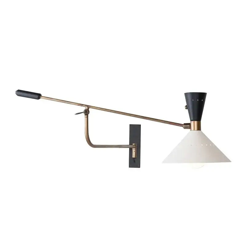 A sleek decorbites adjustable metal bedroom sconce with brass-finished arm and black accents for modern lighting