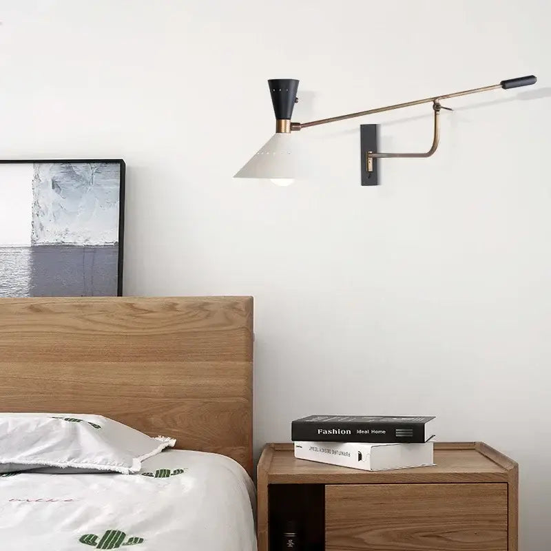 Modern brass and black adjustable metal bedroom sconce with a conical white shade for decorbites adjustable metal lighting