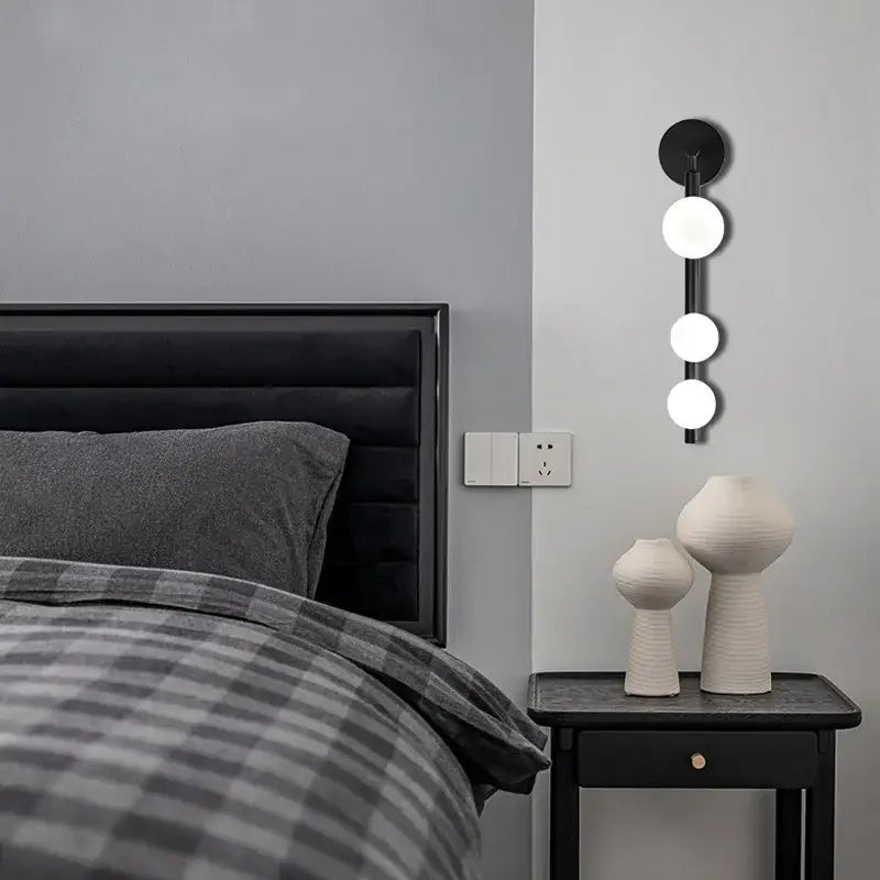 Modern brass and black frosted glass wall lamp with three spherical bulbs for living room decorbites elegant mirror headlight