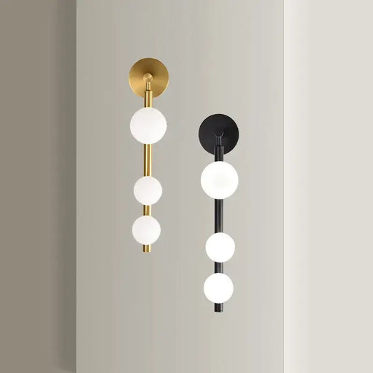 Modern brass and black frosted glass wall lamp with three spherical sconces for living room decorbites elegant mirror headlight