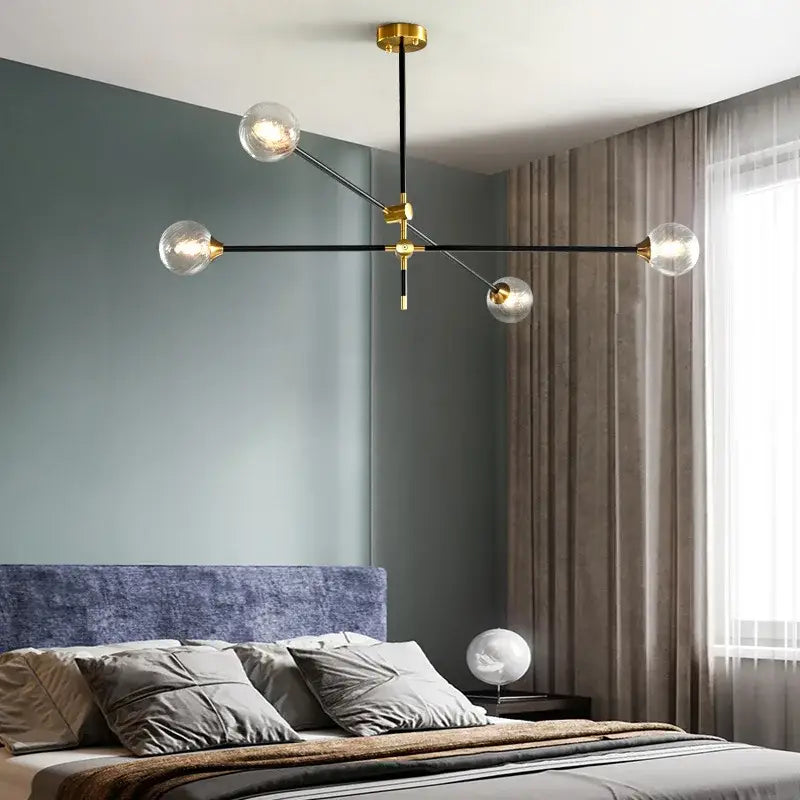 Modern brass and black geometric glass ball chandelier with clear glass globe bulbs for dining room decorbites geometric glass