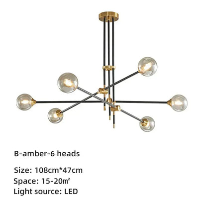 Modern brass and black geometric glass ball chandelier with six spherical bulbs and gold-toned decorbites geometric glass accents