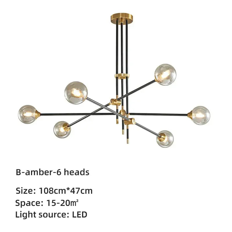 Modern brass and black geometric glass ball chandelier with six spherical bulbs and gold-toned decorbites geometric glass accents