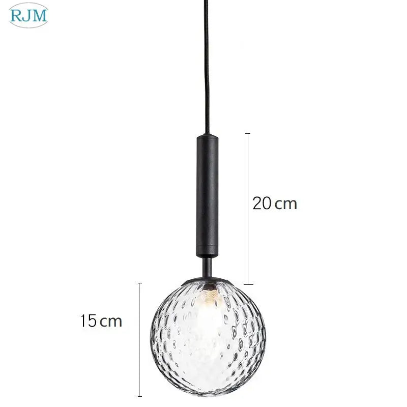 Modern brass and black glass ball led pendant light featuring a clear textured glass globe with a black metal rod for dining room decorbites glass ball pendant light