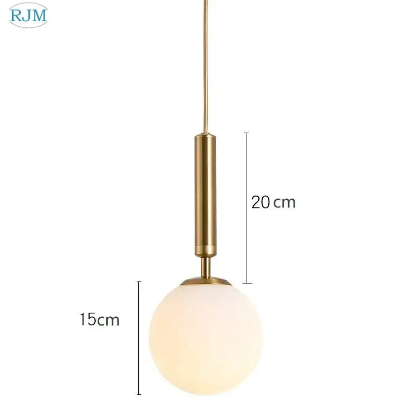 Modern brass and black decorbites glass ball led pendant light with gold-toned stem and frosted glass globe for dining room