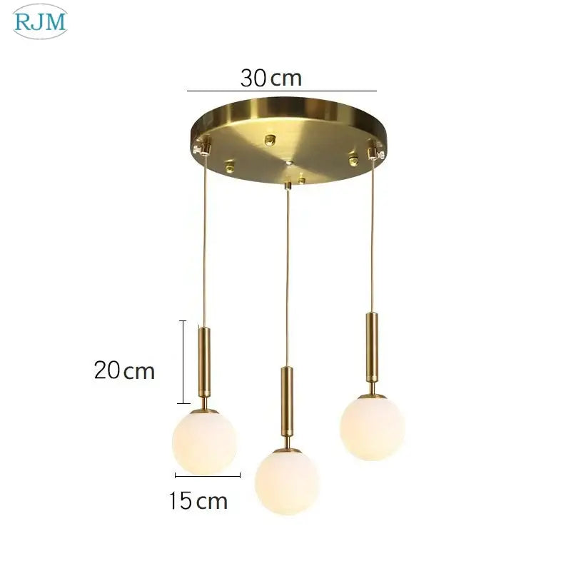 Modern brass and black glass ball led pendant light with gold-toned rods and frosted spheres for dining room decorbites glass ball