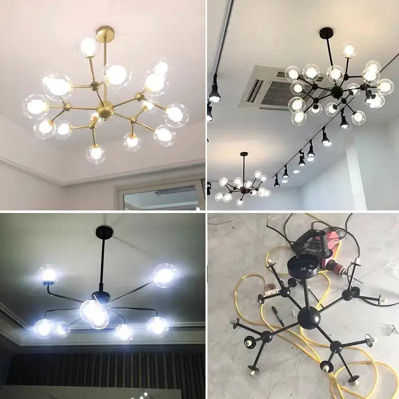 Modern brass and black glass ball pendant chandelier with branching metal frame and clear glass ball bulbs for dining room decorbites glass ball