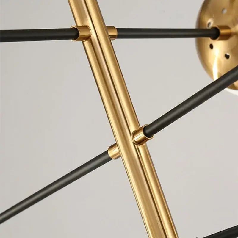 Modern brass and black glass bubble chandelier with polished brass and matte black rods for dining room decorbites glass bubble lighting