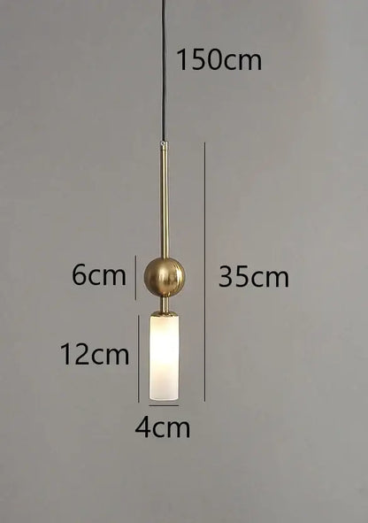 Modern brass pendant light with frosted glass cylinder and spherical top designed for dining room with led bulb