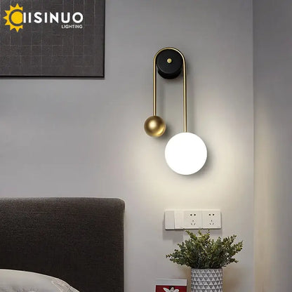 Modern brass and black led wall sconce with spherical light fixture for living room decorbites led wall sconce