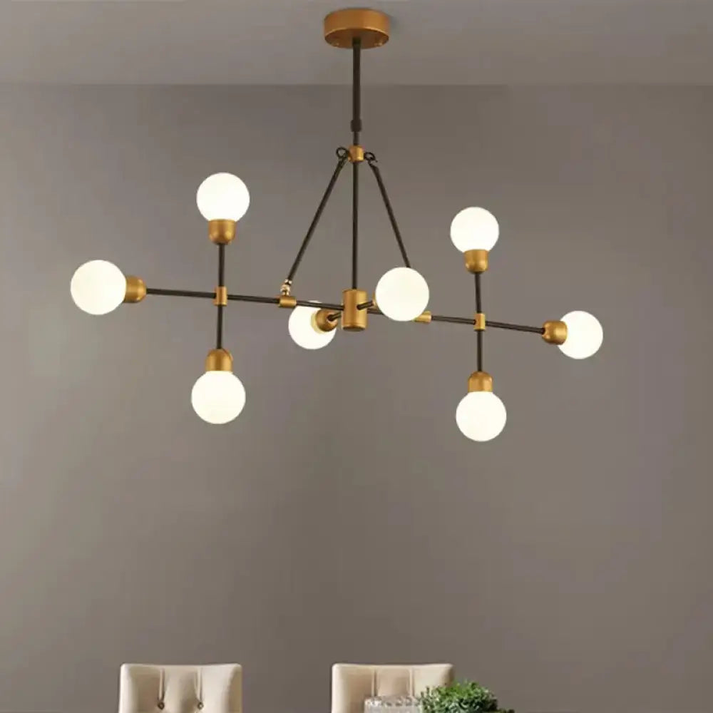 DecorBites™ brass finish island light with orb shade featuring six frosted glass globes for dining room use