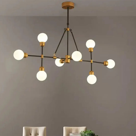 DecorBites™ brass finish island light with orb shade featuring six frosted glass globes for dining room use