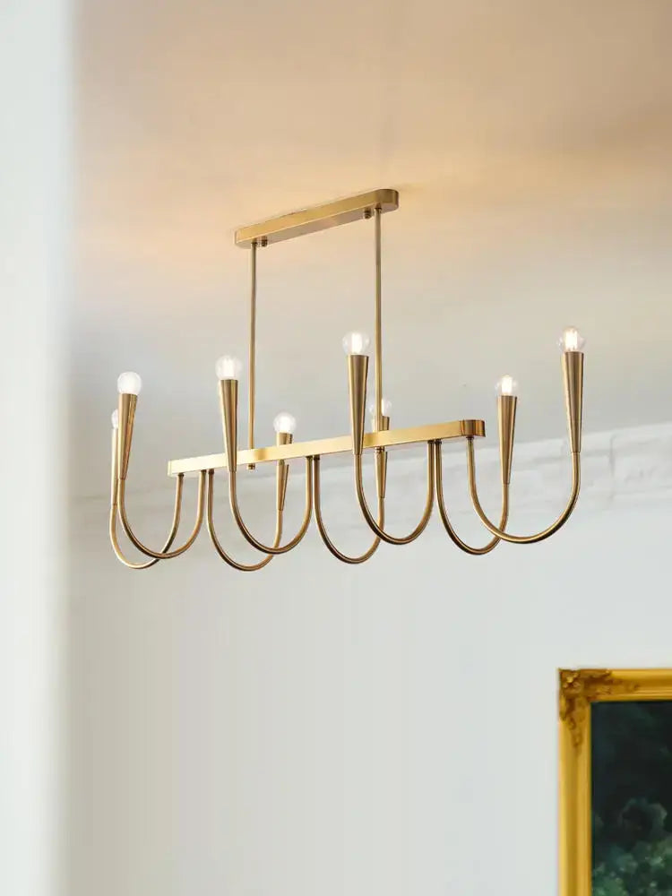 Modern brass black pendant chandelier with gold-toned curved arms and exposed bulbs for kitchen island lighting decorbites black pendant