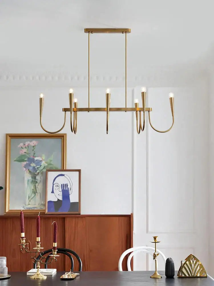 Modern brass black pendant chandelier with multiple curved arms and candle-style lights perfect for kitchen island decorbites black pendant