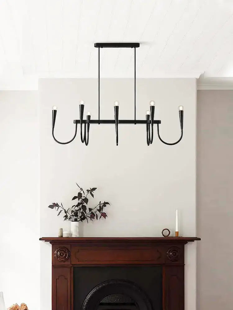Modern brass black pendant chandelier with six curved arms and exposed bulbs for kitchen island lighting decorbites black pendant
