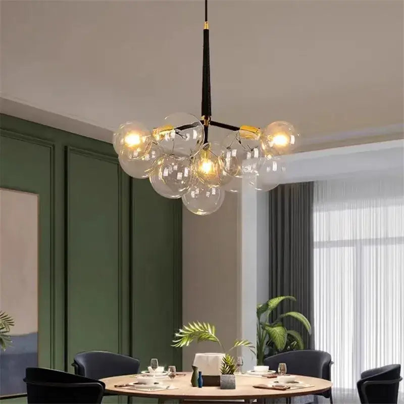 Modern brass bubble chandelier with glass led bulbs and black and gold accents for bedroom lighting decorbites bubble chandelier