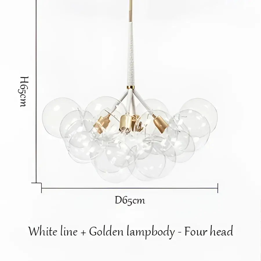 A modern brass bubble chandelier with four clear glass globes suspended from a white line by decorbites bubble chandelier