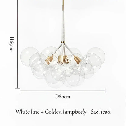 Modern brass bubble chandelier with six clear glass spheres and white lampbody accented by golden fixtures for bedroom decorbites bubble chandelier