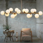 Modern brass bubbled island light fixture with frosted glass globe bulbs for dining room chandelier lighting