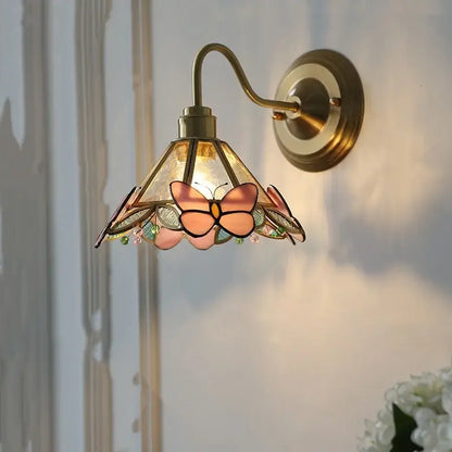 Antique brass wall sconce with stained glass shade featuring pink and peach butterfly motifs for bedroom decorbites clear glass