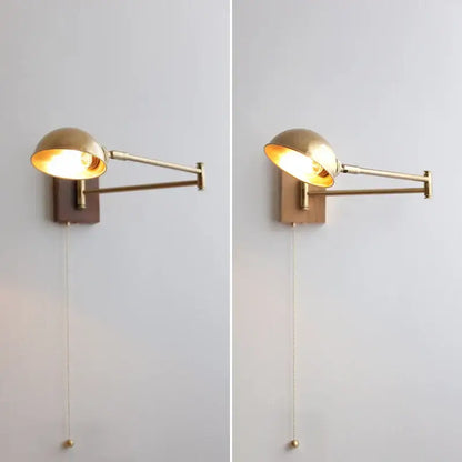 Modern brass canopy led wall light featuring a brass-finished adjustable wall sconce with a domed shade and wooden backplate
