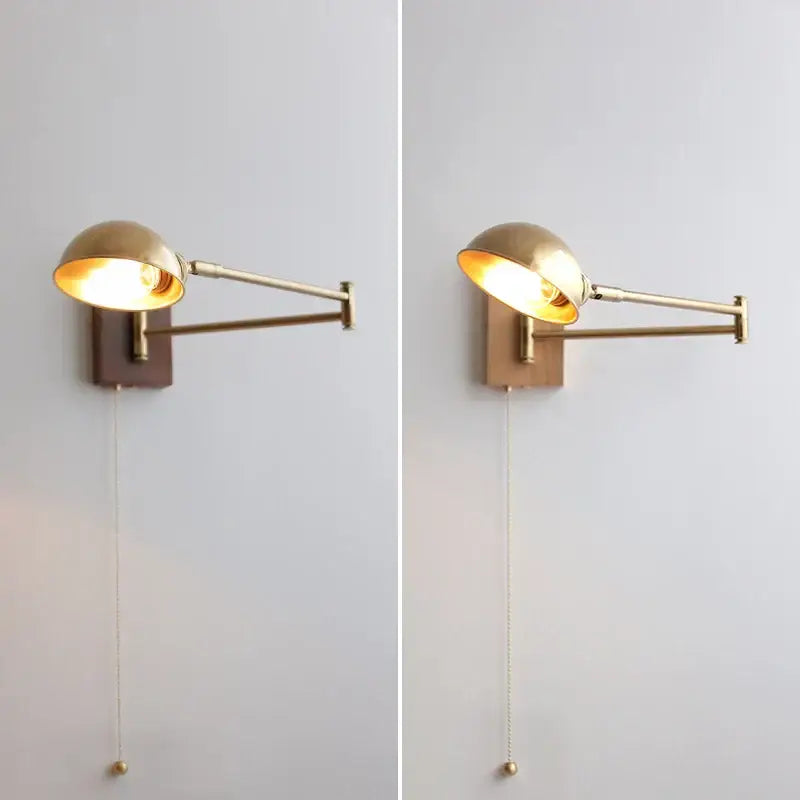 Modern brass canopy led wall light featuring a brass-finished adjustable wall sconce with a domed shade and wooden backplate