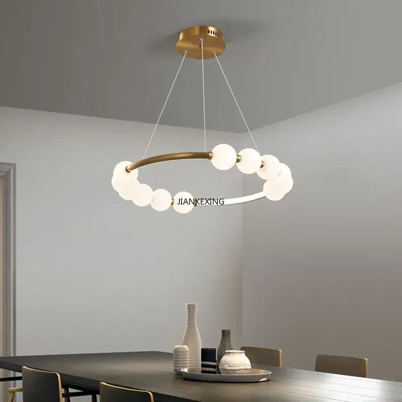 Modern brass circle ring led pendant light with gold-toned frame and frosted globe bulbs for dining room decorbites circle ring