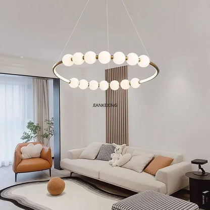 Modern brass circle ring led pendant light with sleek brass frame and frosted glass globe bulbs for dining room decorbites circle ring