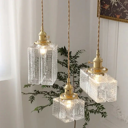 Modern brass clear glass led pendant light with textured decorbites clear glass and twisted cord for dining room decor