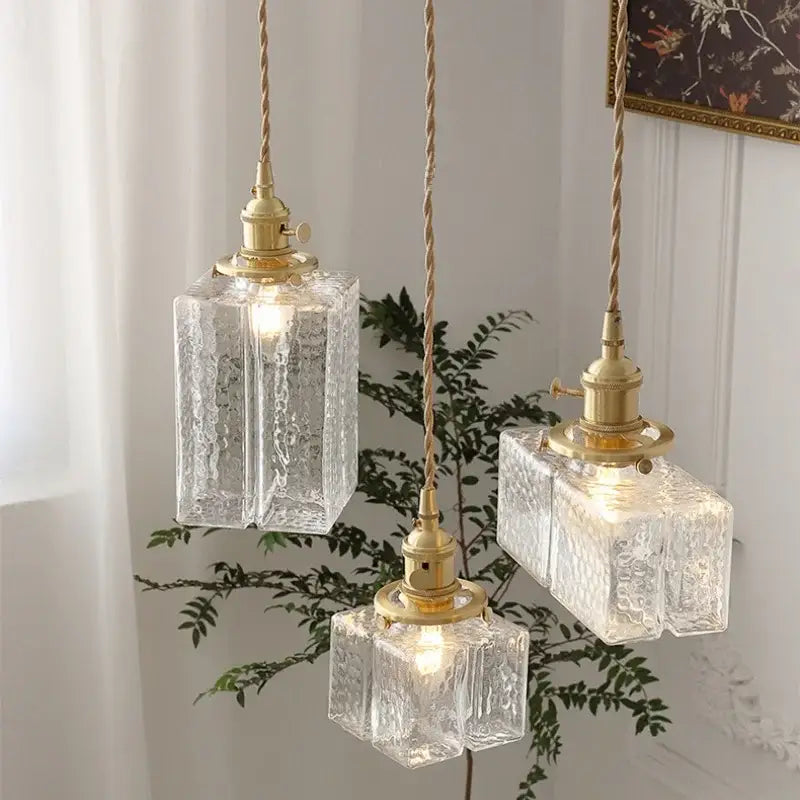 Modern brass clear glass led pendant light with textured decorbites clear glass and twisted cord for dining room decor