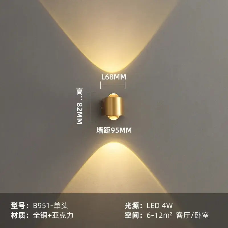 Modern brass copper led wall lamp with gold cylindrical design casting symmetrical warm light for bedroom reading decorbites copper led wall