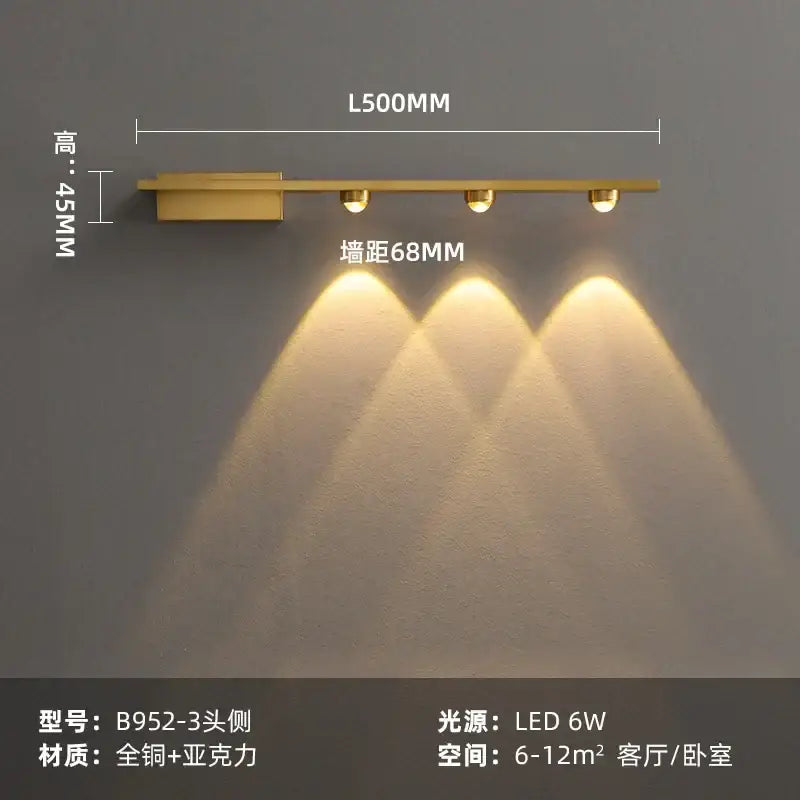 Modern brass copper led wall lamp with gold finish, three circular bulbs, and sleek rectangular base for bedroom reading light