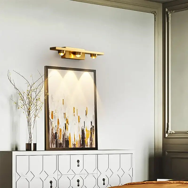 Modern brass copper led wall lamp with gold-toned spherical bulbs for bedroom reading light by decorbites copper led wall