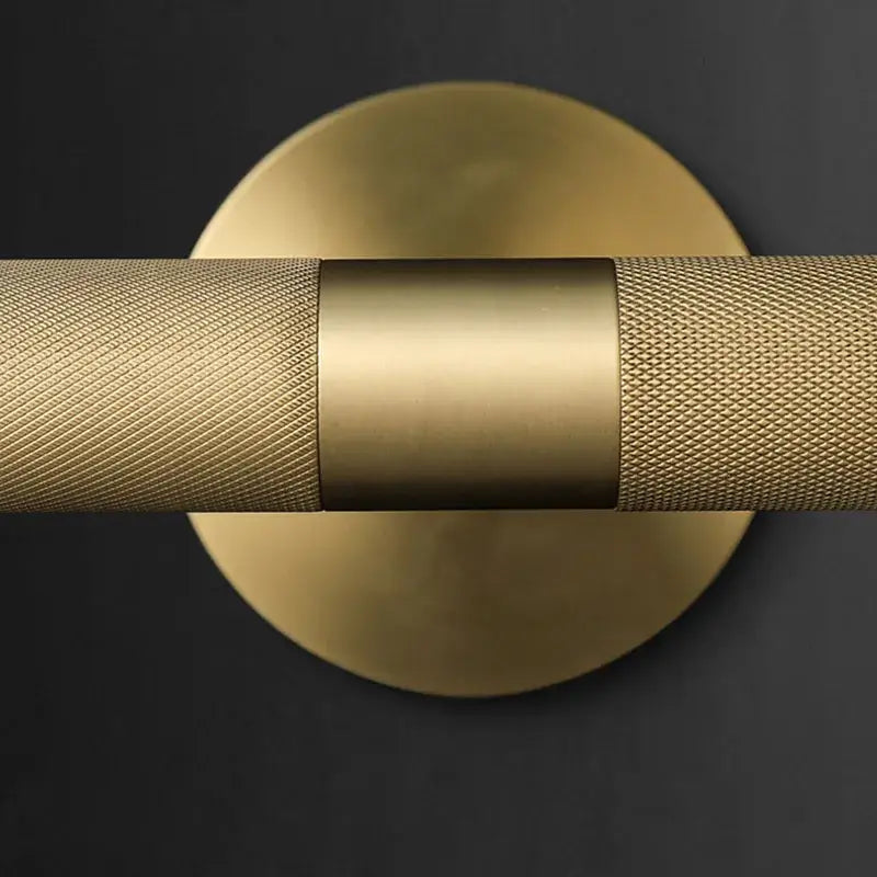 Modern brass copper mirror wall lamp with gold-toned textured cylindrical bar and smooth central band for bedroom decorbites brass copper