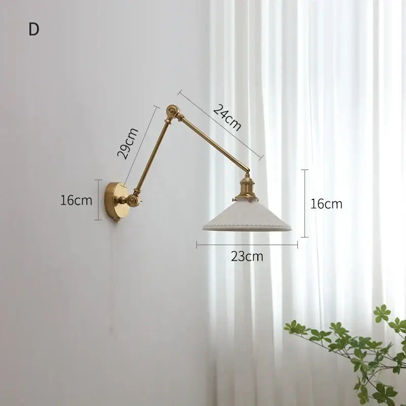 Modern brass copper swing arm wall sconce with brass finish and white ceramic shade for elegant bedroom decorbites copper swing